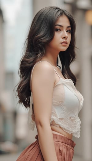 A youthful woman, her raven locks cascading down her back, stands confidently in a dynamic pose. Wearing a sheer white singlet that cleverly conceals her modesty, and a pleated miniskirt that showcases her toned legs. The blurred background allows the building on the right to subtly frame her striking figure, drawing attention to her captivating presence