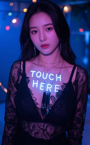 a hubgwoman with long dark hair, wearing a black lace dress, adorned with a necklace and earrings. The woman's chest is adorned with blue letters that spell out "TOUCH HERE" in a glowing light-up font. The backdrop is a vibrant blue, with a few colorful lights in the distance.