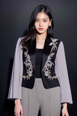 beautiful girl 20 years old, (Zee_JKT48, zeeJKT48), (cowboy shot), pale skin, (solid dark background:1.4), looking at viewer, (realistic:1.9), slender body,(detailed skin, detailed clothing, detailed texture:1.4), wearing a ((sleek tailored pantsuit in a muted lavender shade, featuring exaggerated sleeves and pearl embellishments)), Raw Photo, (high quality:1.4)