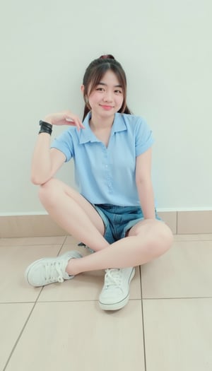 A young Asian woman with dark brown hair, posed on a step, wearing a light blue short-sleeved button-down shirt and blue shorts. She sits cross-legged, left hand resting on hip, right hand crossed over shoulder for balance. Black bracelet adorns her left wrist, black band her right. White sneakers with black laces complement the outfit. Her smile brightens the scene as she leans slightly on her bent left leg, right leg resting on the step. Ponytailed hair and a light beige tiled floor provide a serene background, with a white wall behind her.