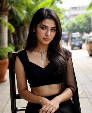  girl wearing saree,  1girl, solo_focus, a ultra real full body shot photo of 26 years old New Delhi Actress, with long brown hair and intricate details of her perfect face. Her dress ((a black sexy saree and eye glasses)), perfect eyes, wearing ((high heels black long heels)), her skin complexion is very fair, outdoors, buildings, sitting on chair at home, Indian, Woman, eyeglass real, look in camera