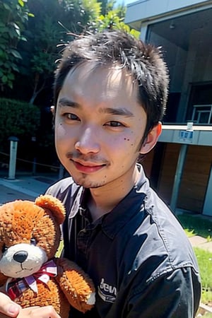 A young boy with warm brown eyes looks directly into the camera lens, his expression gentle and inviting. His light pink hair is messy and endearing, framing his heart-shaped face. He clutches a worn teddy bear in his arms, its faded fabric a testament to its importance. Wearing a crisp black collared shirt, he stands out against the lush greenery of the park, with a brilliant blue sky serving as a stunning backdrop.