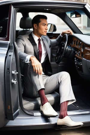 1guy, full body, over the calf socks with burgundy vertical stripe, charcoal formal suit,  sitting in the driver's seat and getting out from the rolls royce car, car door opened, view from outside to the car, in the city, wearing shorts, eye level view, european with black hair, RAW, realistic, soft lighting, pinstripe, elbow hanging on the car window, hand resting on steering wheel, left leg step on the floor, collar shirt