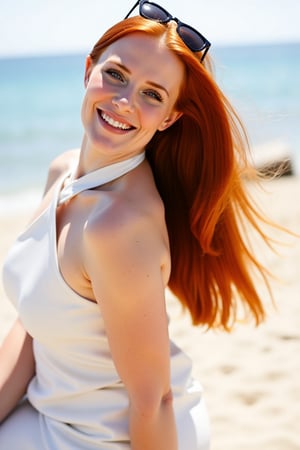 Portrait of a redhead girl with long, straight, and silky hair, wearing a white halter dress and sunglasses. She looks at the camera with a happy expression, as the sunlight illuminates her body. In the background, appears a beach on a sunny day.