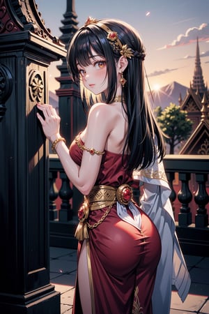 A half-body shot of a beautiful Thai girl standing gracefully in front of a traditional Thai temple at dusk. She wears an exquisite, intricate Thai dress (chut Thai) made of rich silk in a deep gold and crimson color. The top portion of her dress is wrapped in a delicate silk shawl, draped over one shoulder, adorned with traditional gold embroidery and subtle patterns. Her long, dark hair is neatly styled, cascading down her back, with a gold hairpiece delicately holding part of it in place. Her face exudes calm elegance, with a serene expression that matches the tranquil atmosphere of the evening. The temple behind her, with its ornate carvings and golden accents, glows softly in the fading light of the sunset, enhancing the rich cultural beauty of the scene.