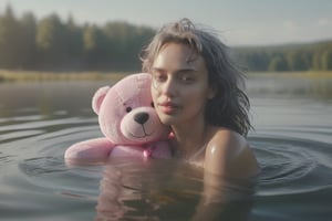 a realistic photo of a beautiful woman (Irina Shayk)bathing naked in a lake with a floating pink teddy bear. She has chin length messy silver hair with sharp cut bangs. It is a bright and misty summer morning. slim body, body measurement 34b-24-34, slim body. deep v. side lighting, backlight. shadow on face. very thin eyebrows. long eyelashes. light leak. lens glare. 
