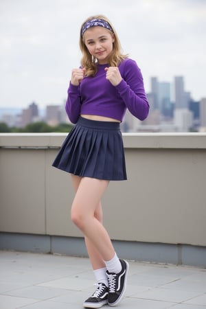 professional photo, chloe grace moretz, youthful facial features, pleated miniskirt, short skirt, crop top, knee socks, headband, purple outfit, sneakers, smirk, fighting stance, one leg up, standing on rooftop, facing viewer, dynamic pose, closeup