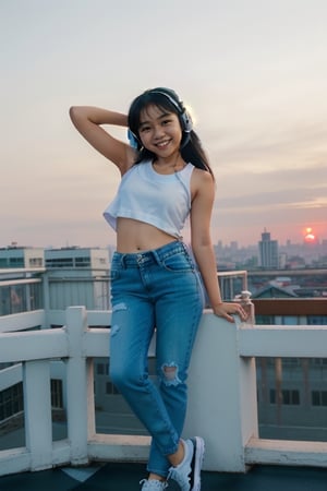 long shot of cute indonesian girl wearing headphone, smiling, innocent. cute pose. medium body, wear oversized white tanktop, wear tight black denim, wear sneakers. photo on rooftop, city background, sunset. fun poses, confident.