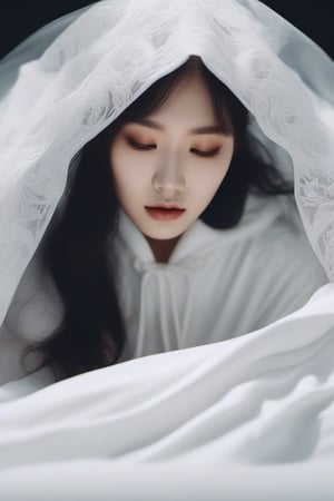 buried underneath a long white hooded lace cape, a melting korean bride laying flat underneath a melting long flowing white cloak