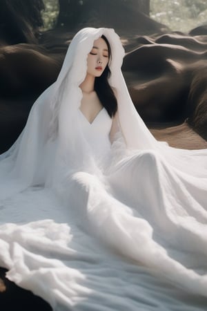buried underneath a long white hooded lace cape, a melting korean bride laying flat underneath a melting long flowing white gown