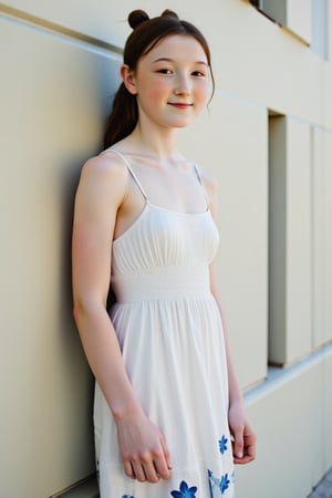 A very tall, slim,16-year-old girl casually leans against a wall. She wears a sheer white sundress with blue flowers embroidered along the hem, long straight black hair tied back with a ribbon. She gazes straight at the camera, smiling gently. 