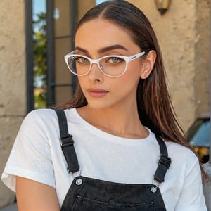 Full realistic photo from far of a stylish young woman with large, captivating eyes, thick eyebrows, a strong jawline, high cheekbones, and a natural complexion. slim boned, long limbed, lithe and with very little body fat and little muscle .Highlighting her as a modern, approachable virtual influencer
Selfie in white t shirt, black jeans, black goggles 