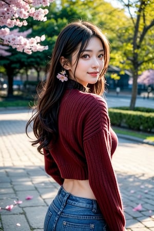 1girl, cowboy shot, solo, long hair, back shot, turned to look at the audience, looking at the audience, smile, curly hair, wide shot, movie lighting, spring, dense cherry blossom path with cherry blossom petals on the ground, dark eyes, lips, character cosplay, hands on face, realistic, off-white sweater, V-neck, midriff, medium breasts, cleavage, blue jeans, dark brown backpack