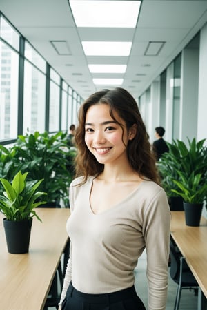 A young woman with wavy brown hair and a gentle smile stands in a modern office. She wears a light-colored V-neck top, exuding warmth and approachability. The office is spacious and well-lit, with large windows revealing a cityscape of tall buildings. Long wooden tables, adorned with green plants, host several individuals engaged in work. The overall atmosphere is dynamic and collaborative, with a mix of people standing and sitting on black office chairs. The image, captured in 8K Ultra HD, highlights the woman in sharp focus against a slightly blurred, bustling background.