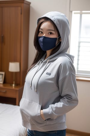 Asian women wearing hoodie and at home with mask 