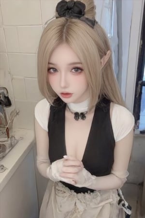 The image shows a young woman wearing a black and white maid outfit. She is standing in a kitchen with white tiles on the walls and a window on the right side. The woman has blonde hair styled in a half-up, half-down ponytail with a black bow on top. She has a black choker necklace around her neck and a white apron with ruffles on the bottom. Her hands are clasped together in front of her and she is looking directly at the camera with a serious expression. The overall style of the outfit is elegant and sophisticated.