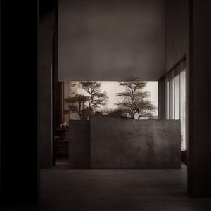 “An interior view of Tadao Ando’s Sendai Mediatheque transformed into an exhibition space focused on architectural and interior design. The gallery showcases minimalist structures and modernist furniture pieces that echo Ando’s signature use of concrete, light, and space. The atmosphere is serene and contemplative, with natural light filtering through the large glass facades, casting soft shadows on the polished concrete floors. The exhibition layout is clean and organized, with each display harmonizing with the surrounding architectural elements.”