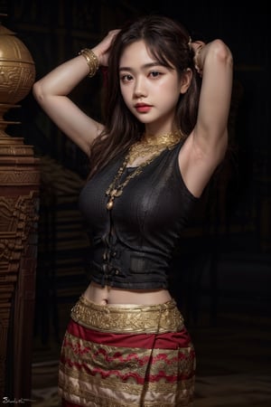 The image features a woman with long dark hair, wearing a black top and a traditional, ornate skirt with gold and red accents. She has her left hand on her head, and her right hand is on her hip. She is wearing a necklace with a large pendant and has a neutral expression on her face. The style of the image is a fashion or portrait photograph with a focus on the subject's attire and pose.((arms up))
