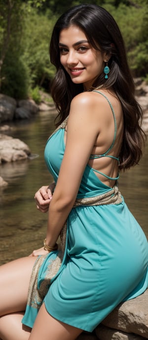 A serene 25-year-old beauty sits beside a tranquil river, her long black hair flowing like a dark waterfall down her back. Framed by healthy locks, her striking features shine with friendliness and warmth. Natural makeup enhances her expressive eyes, inviting the viewer to share in her tranquility. A beige dress with intricate details hugs her waist, its low-cut neckline adorned with delicate trim and fringe. A turquoise necklace and earrings add vibrancy against her porcelain skin. Her body turns slightly to the side, one hand resting on her knee while the other touches the ground, as she smiles warmly, radiating approachability and joy.