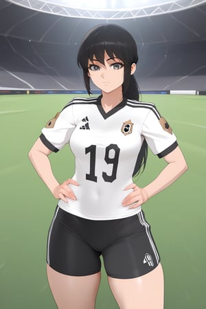 black-haired girl, wearing a black soccer uniform with gold details, on a soccer field