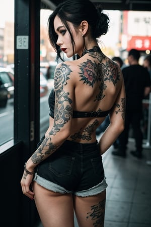 detailed photo,1girl,tattoo on whole body yakuza body tattoo, looking_at_viewer,from behind,shorts,tattoo on back,gothic style make up,uhd, sfw