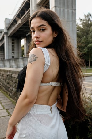 A stunning Nordic girl stands proudly against a moss concrete wall, bathed in warm sunlight. Her porcelain-doll complexion glows with a subtle sheen, showcasing realistic skin textures. Her striking features are framed by luscious locks of long, curly hair that cascade down her back like a golden waterfall.

Her piercing blue eyes, accentuated by thick lashes and defined eyebrows, seem to sparkle with an inner light. A scattering of freckles across the bridge of her nose adds to her natural beauty.

She wears a crisp white and grey Qatar Airways Chelsea football team jersey, emblazoned with the airline's logo on the chest. The black text and intricate design within the circle catch the eye, while Puma's jumping cat logo sits below. A sleeveless arm is visible, showcasing vibrant tattoos that dance across her skin.

The moss concrete wall behind her provides a lush, earthy backdrop, subtly textured to evoke a sense of aged stone.