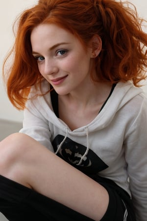 A whimsical snapshot: A provocative 25-year-old girl , ginger head, with ravishing auburn locks and freckles sits serenely, beaming at the camera with an irresistible grin. Her eyes shine like gemstones, casting a gentle glow on her porcelain skin. She wears an oversized croped with batman logo and hood, baggy sweat pants, her delicate features framed by a halo of luscious hair, suspended in time.
