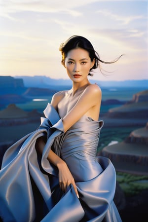 Haute Couture of Gainsboro Gray unfurls across the upper body (1.4) of a stunning asian female model, posed against a breathtaking landscape at summer's dusk. The professional medium format film captures every detail as Richard Avedon's lens sharpens on her elegance. Soft, golden light casts a warm glow on her features, set against a backdrop of fantastic scenery with intense colors (4). 