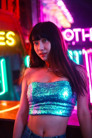 A sultry beauty with luscious brown hair and straight bangs stands out against a kaleidoscope of vibrant neon lights. She wears the Kakaco Sequins Tube Top, its sequins catching the soft glow of the blue and red lights surrounding her. The blurred neon signs in the background create a dynamic urban setting. Her dreamy expression is illuminated by the subtle neon light, which adds a touch of mystery to her calm demeanor. The shallow depth of field focuses on her radiant face, while the reflections of the neon lights add layers of depth and visual interest. This stunning image blends urban energy with serene beauty, making it a perfect magazine cover.