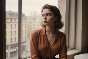 image in warm tones of a young beautiful woman sitting in a cafe next to a window from where she contemplates the city. seen sensual, revealing and classy clothes