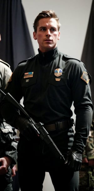 A fragmented figure with a patchwork costume, badges, and pixelated head holds two sleek black objects in front of a camouflaged militia group. Members of the military unit wear tactical gear, patches, and vests with insignia, including one soldier sporting an 'A' symbol on their chest plate, amidst a backdrop of neutral tones and subtle shadows.