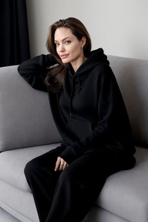 Angelina Jolie, 35 years, smiling,  wearing a black oversize hoodie 100% coton, a short, full body, she is sitting in a sofa in her living room, ultra realistic face, photorealistic