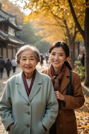 a portrait photo of east-asian tourists, the daughter and 70s grand mother, traveling to China during autumn, taken with an 85mm f/1.4 lens. The shot features soft sunlight from behind, creating gentle shadows and a warm, inviting atmosphere. The stunning-beautiful woman in her 30s taking her 70s grand mother on a trip. Each person has a distinct face and they are relaxed, smiling, and dressed in autumn Fashion. The image conveys joy, fun, and excitement of the trip. 
