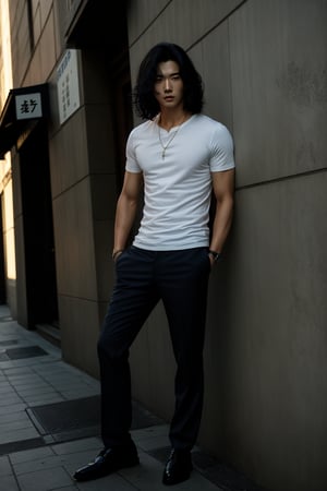 A realistic image of a young Asian man with long, wavy black hair, embodying the influencer persona. He has a slim body, dressed in a trendy outfit featuring trousers, a shirt, and a white t-shirt. The man poses confidently in front of a textured wall on a Seoul street, his gaze fixed on the camera. The composition captures his fashionable ensemble and the urban setting, with natural lighting accentuating the scene's authenticity.