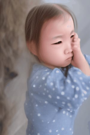 the girl has sad and eyes tears. the girl face very neat and clean and well dress. the girl hair was black color ha long 

