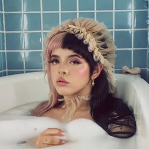 1girl, long straight split dye mullet hair with bangs, black and pink hair, light gray tulle frill shepherd's hat, bath, bathroom, a tub of water,  blue tiles, retro style, retro, retro colors, nose ring, brown eyes, cute face, long lashes, gold elements, lips dirty pink, black eyebrows, pale skin, high quality 18K, Hyperrealism, Realistic vision, rosy cheeks, freckles, high eyes quality, high face quality