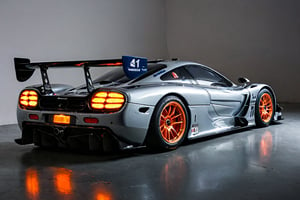 A 1995 McLaren F1 GTR (#41),Dominant,Dimly Lit Garage,Sleek,Blue, Orange, Black,White Lights,Aggressive Aerodynamics,Prominent Rear Wing,Dark Gray Floor,Michelin Logo,Kenwood Logo,Imposing Stance,Competitive Spirit,Dramatic Lighting,Composition,Iconic Supercar,Ready to Pounce,Realistic,Landscape,Artistic,Creative,Surreal,Photo,realistic,landscape,artistic,creative,surreal,photo