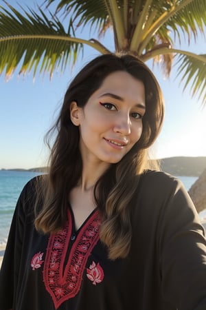 A warm, golden-hour scene in the style of Wong Kar-wai, with a soft, cinematic film grain and subtle lens flares, set against a serene, turquoise ocean and blue sky. A young woman with dark brown, long hair and a warm, wearing a flowing black kaftan adorned with intricate designer red embroidery geometrically shaped, stands on the beach, her bright smile and gentle gaze directed at the camera. Behind her, a palm tree sways gently in the breeze, its lush green leaves rustling softly, as warm, softbox light with a subtle magenta hue casts a warm glow on the scene, accentuated by the subtle, rim lighting of a low-angled sun, creating a sense of peaceful tranquility, with the camera's shallow depth of field softly blurring the background, drawing focus to the woman's serene, sun-kissed beauty, at4r