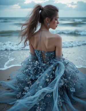 A captivating high-fashion editorial photograph, digitally illustrated with a striking, moody atmosphere. The woman, with long, flowing hair in a high ponytail, sits elegantly on a sandy beach, surrounded by crashing waves and a dramatic sky. Her strapless gown, adorned with exquisite floral embroidery in shades of blue and grey, is accentuated by layers of tulle that cascade around her gracefully. The entire scene is reminiscent of conceptual art and 3D renderings, creating a vibrant, ethereal, and dramatic ambiance.