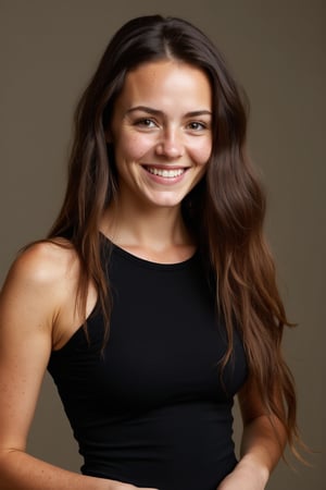 A 30yo woman with very long hair.
She has a cute round face with freckles and smiles.
She is wearing a tight fitting black sleeveless top made from smooth stretch fabric. 