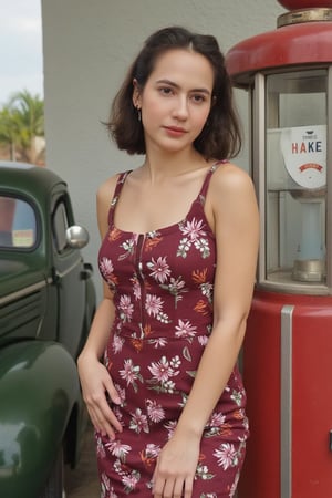 Vintage photography of a pin-up girl PevitaPearce from the 1940s, She is leaning against a vintage car and her hand resting on her hip. The setting is a classic American gas station. natural lighting,soft film grain,30mm, pin up dress.