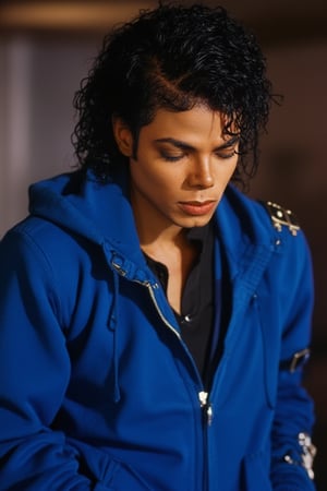 Michael Jackson putting on a blue hoodie 