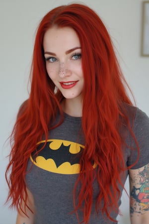 A close-up photo of a 30yo Su1c1de_G1rls woman with very long intense vibrant red colored hair. She has a cute round face with freckles, body covered in tattoos, red lipstick, striking blue eyes, and smiles. She is wearing a skin-tight fitted graphic T-shirt made from smooth stretch fabric with a yellow Batman logo. 