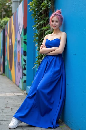 a super realistic full body image of an asian girl, leans casually against a bright blue wall in an urban setting, wearing a stunning royal blue evening gown that flows elegantly with her movements. She has one foot resting on the wall, with her arms crossed and a playful smirk on her face. Her pink hair is styled in a messy bun, and she sports stylish sneakers. The background is vibrant, featuring colorful street art and greenery peeking through, creating an artistic and lively atmosphere.