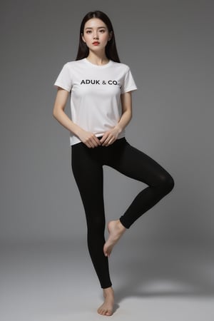 A striking image: a sexy girl with sexy long legs and feet standing dynamic pose on a sleek gray surface. His porcelain skin is set off by the vibrant red hue of her lips, while the stark contrast between her white tshirt graphic text with helvetica font, text " ADUK & CO ". Shes wearing black fit yoga phants. and the all-gray background creates an air of sophistication and elegance.