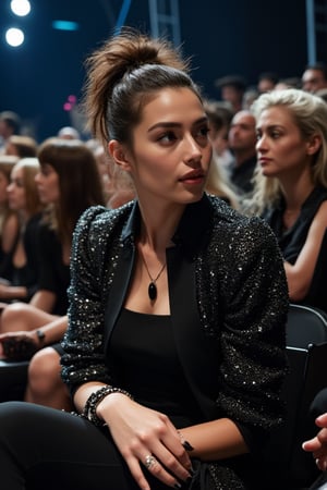 A stunning woman is seated in the front row of an exclusive fashion show. She’s dressed in a chic, high-fashion outfit, complete with bold accessories that highlight her stylish confidence. The runway is illuminated with vibrant lights as models strut by, but her presence is magnetic. Photographers and onlookers can’t help but glance her way as she watches with a cool, composed expression. The venue is a sleek, modern space with avant-garde designs surrounding her, perfectly accentuating her flawless look and innate sense of style. kwon-nara