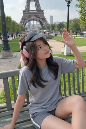 Master piece, generate image of a Girl with headphones, cap, dreamy expression, sitting a bench in the gardens of the Eiffel tower, training wear, t-shirt and sport shorts, (ultra detailed perfect piece:1.2), illustration, masterpiece, (extremely detailed CG 8k), (very fine 8K CG), (1girl:1.2), (dark hair), long hair, wavy hair, hair over one eye, sparkling, light blue eyes, looking at side,