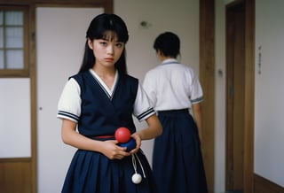  A cinematic film still of Yoko Minamino as Sukeban Deka, wearing dark blue Sailor Fuku long skirt, holding a toy yoyo in her hand, 80s Japanese Drama. Canon 5d Mark 4, Kodak Ektar, 35mm 