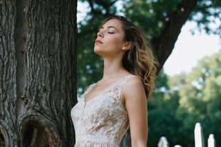 Photo.  Profile of a woman in a lace summer dress, She is looking upward with her eyes closed beside a tree.  Background is a cemetery. Style by J.C. Leyendecker. Canon 5d Mark 4, Kodak Ektar, 35mm