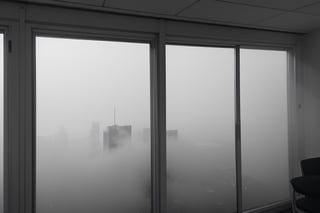 very wide shot,distant screen,eye-level,city outside the window,(( vague  white fogs)),front view,gray scale,